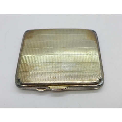 878 - A silver cigarette case, Birmingham 1935, 76g