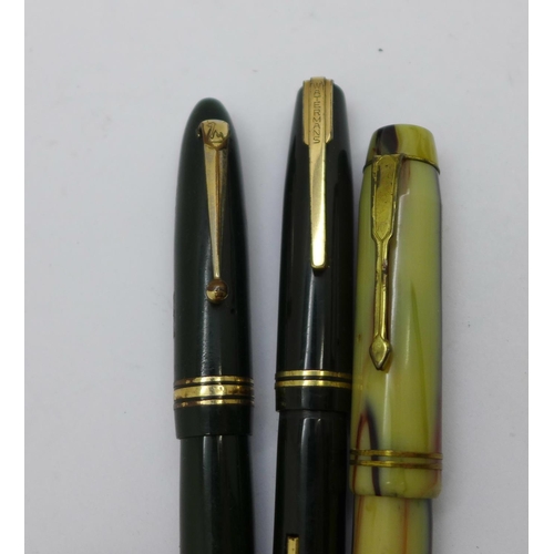 881 - Four fountain pens with 14ct gold nibs, Waterman's, Swan, The Unique Pen lacking end cap and one in ... 