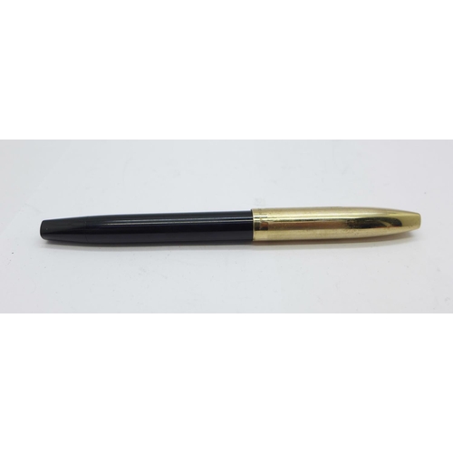 886 - A Sheaffer pump action pen with 14k gold nib