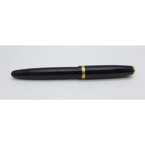 891 - A Parker Duofold pen with 14k nib and pump action