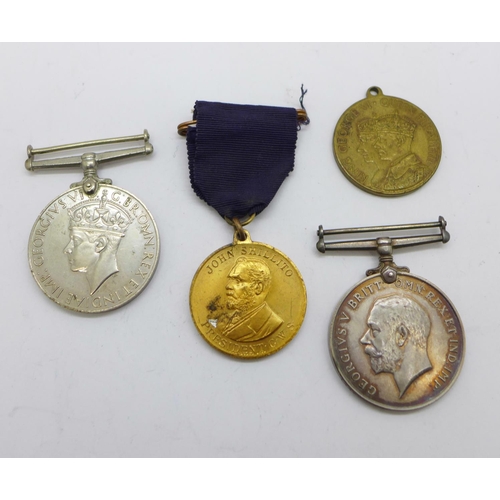 894 - A WWI medal to 144789 Gnr. C.L. Batley R.A., a WWII medal and two other medallions