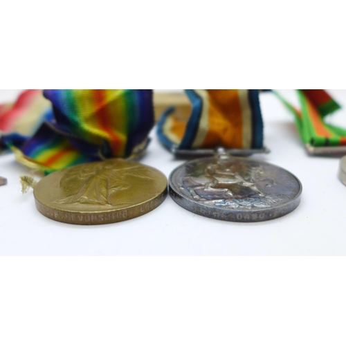 896 - A trio of WWI medals to 20415 Pte. C.F. Devonshire Leicestershire Regiment, the Victory Medal number... 