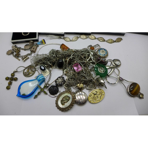 900 - A collection of mainly silver jewellery, etc., including two charm bracelets, chains, pendants inclu... 