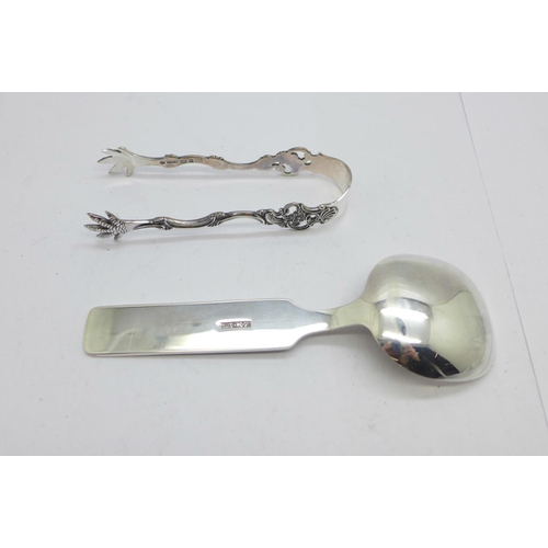 940 - A pair of Norwegian silver sugar bows, boxed, and a plated spoon