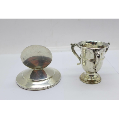 949 - A silver stag menu holder, William Hutton & Sons Ltd, Sheffield 1937 and a small silver trophy, Walk... 