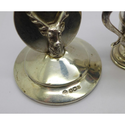 949 - A silver stag menu holder, William Hutton & Sons Ltd, Sheffield 1937 and a small silver trophy, Walk... 