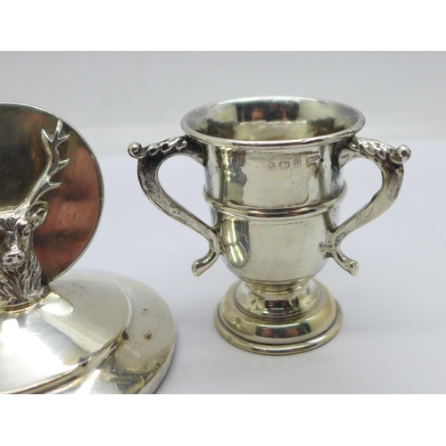 949 - A silver stag menu holder, William Hutton & Sons Ltd, Sheffield 1937 and a small silver trophy, Walk... 