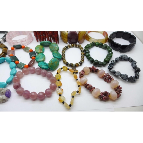 975 - Gemstone bracelets including opalite, coral, tigers eye, etc.