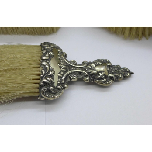 987 - Two silver backed brushes and a silver mounted brush, clothes brush a/f