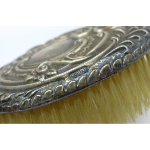 987 - Two silver backed brushes and a silver mounted brush, clothes brush a/f