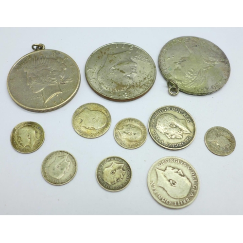 999 - Eight pre 1920 silver coins, a mounted Marie Theresia coin, a mounted 1922 American $1 coin and a 19... 