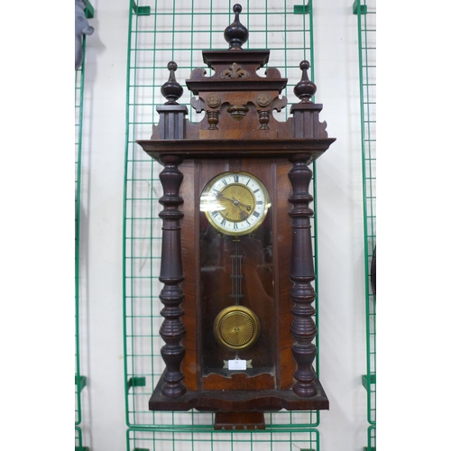 22 - A 19th Century walnut Vienna wall clock