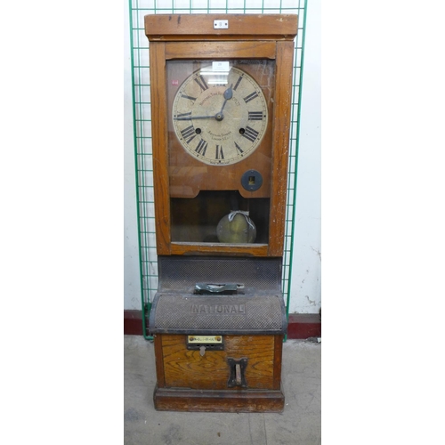 28 - An early 20th Century oak National Time Recorder Co. Ltd. clock