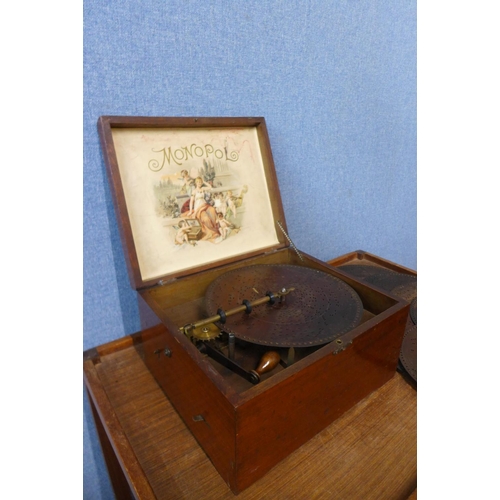 29 - A 19th Century Swiss painted mahogany Monopol music box, with eight discs