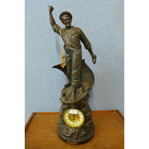 32 - A large 19th Century spelter figural  mantel clock, titled  Cod Fishing, 75cms h