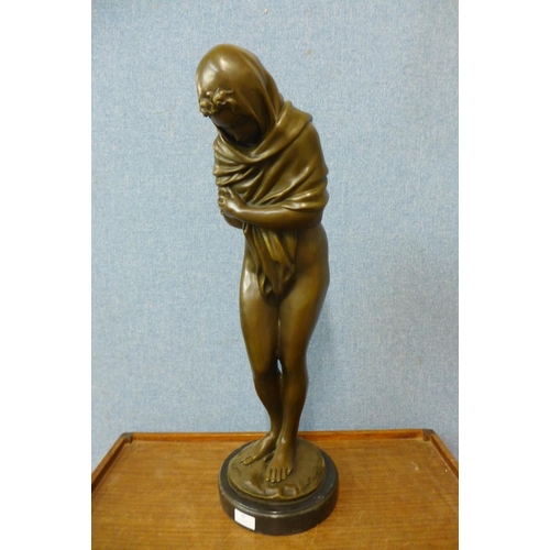 43 - A large French style bronze figure of a semi-nude bathing female, on black marble socle, 69cms h