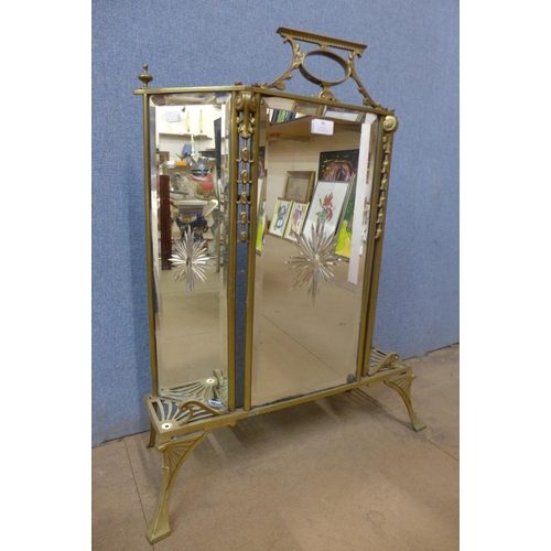 48 - An Art Nouveau brass firescreen