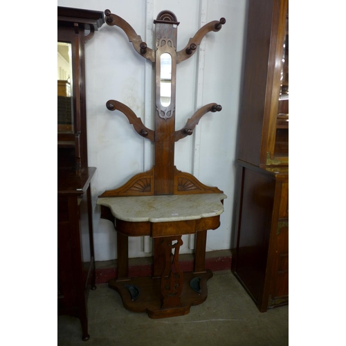 54 - A Victorian walnut and marble topped tree shaped hallstand