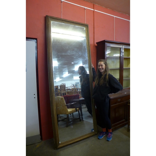 65 - An extremely large Victorian gilt gesso framed mirror, 253 x 90cms