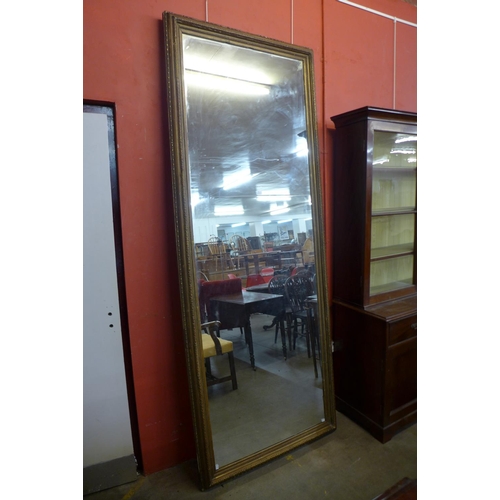 65 - An extremely large Victorian gilt gesso framed mirror, 253 x 90cms