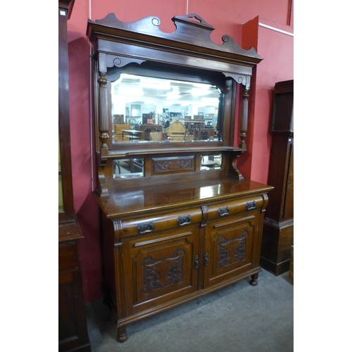 68 - An Edward VII carved walnut mirrorback sideboard