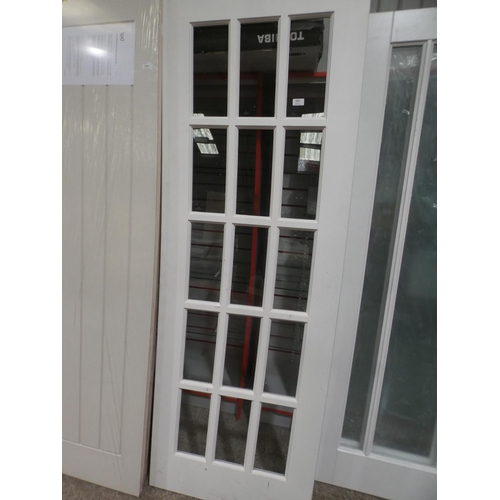 3003 - A white primed fifteen panel glass and timber internal door (1981x687x35mm) * this lot is subject to... 