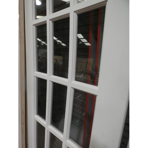 3003 - A white primed fifteen panel glass and timber internal door (1981x687x35mm) * this lot is subject to... 