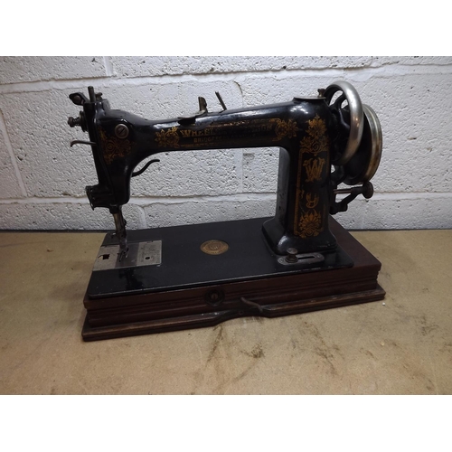 2047 - Antique 1890's wheeler & Wilson sewing machine - in wooden case