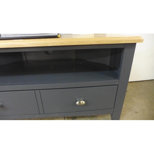 1395 - A Gloucester blue painted oak corner TV unit (GA-CTV0-G)  *this lot is subject to VAT Small crack to... 