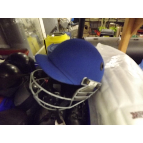 2313 - Qty. of sporting equipment inc. cricket pads, cricket helmets, boxing gloves, racquets, 4 green bowl... 