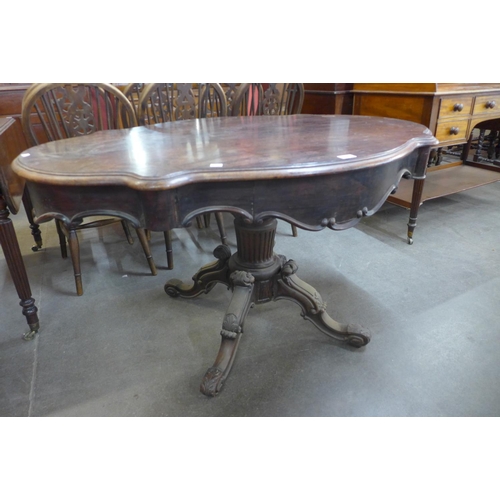 109 - A 19th Century French rosewood two drawer serpentine centre table