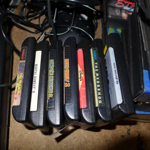 2136 - 2 Sega Mega Drive, 2 consoles, 6 controllers, assorted cables with 15 boxed games & 6 loose games