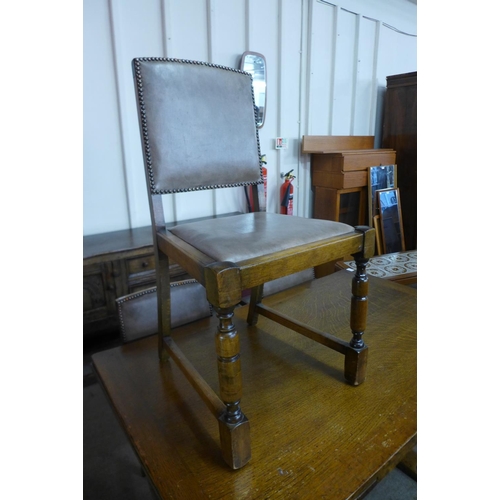 164 - A 17th Century style Ipswich oak draw-leaf refectory table and four dining chairs