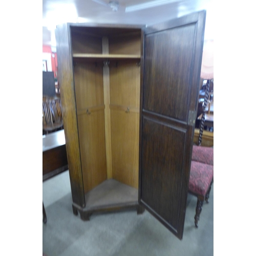 222 - An oak corner hall robe