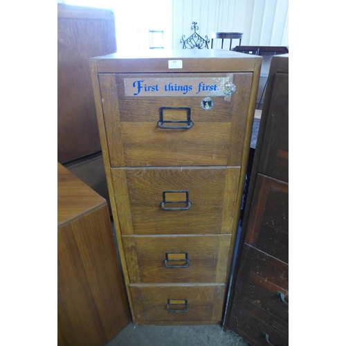 176 - An oak filing cabinet