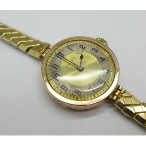 1002 - A 9ct gold cased lady's Rolex 15 jewels wristwatch, the movement and dial marked Rolex, the case bac... 