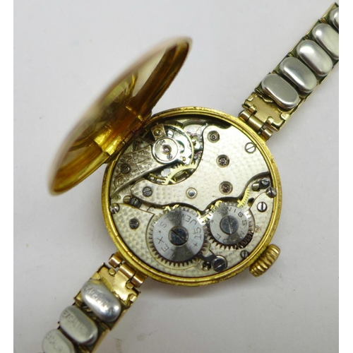 1002 - A 9ct gold cased lady's Rolex 15 jewels wristwatch, the movement and dial marked Rolex, the case bac... 