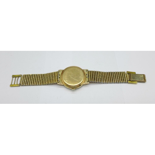 1005 - A 9ct gold cased Rotary wristwatch on a rolled gold bracelet, 33mm case