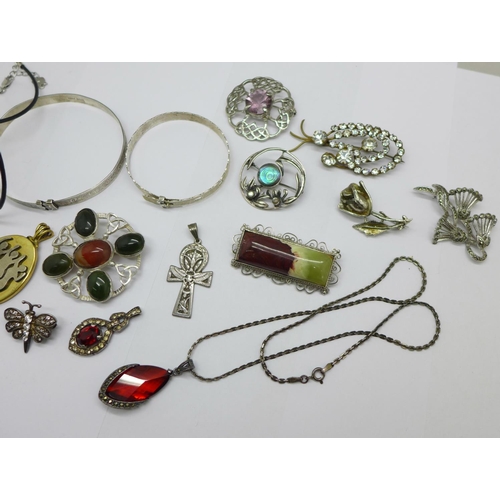 1028 - A collection of jewellery including two silver bangles, two silver brooches including one Scottish s... 