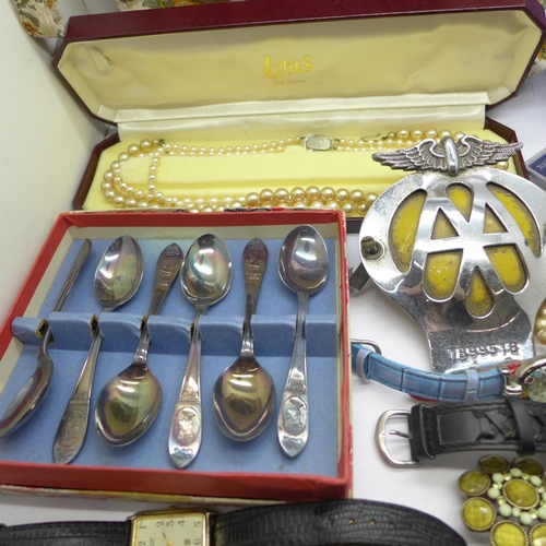 1057 - Costume jewellery, wristwatches, AA badge, crowns, plated spoons, etc.