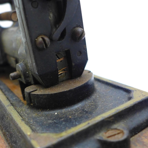 661 - A c.1910 stapler and three razor sharpeners