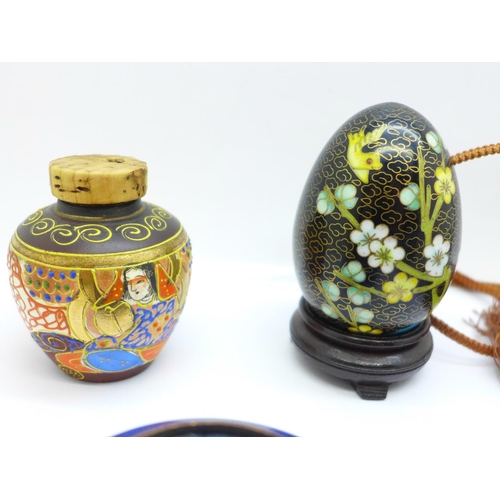 702 - Two cloisonne opium necklaces, an ashtray, egg on stand and a small spice jar