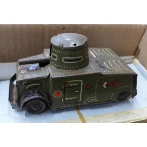 726 - A collection of military die-cast vehicles including large cannon, tank, lorry and armoured vehicle ... 