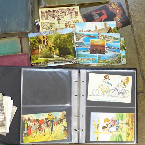 792 - Six empty postcard albums, a small collection of postcards including humorous