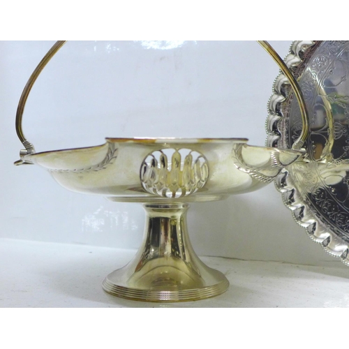 801 - An Art Nouveau silver plated swing handle basket, a plated tray on three ball and claw feet and a pa... 