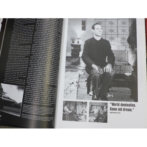 810 - A James Bond photograph with signature, framed, three James Bond books, The Making of 007, The Essen... 