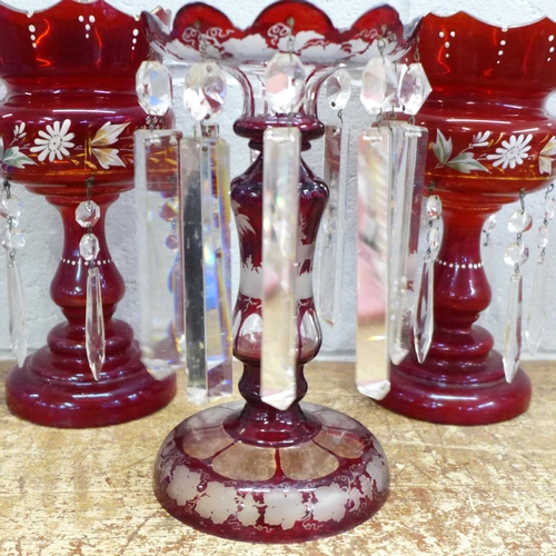 819 - A pair of ruby glass lustres and one other flash cut ruby glass lustre, a/f (small chips to top)