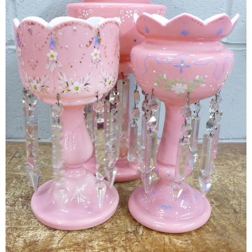 820 - Two similar pink glass lustres and one larger lustre (one drop a/f)