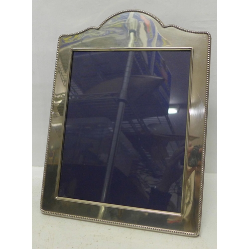 848 - A modern silver photograph frame, Carrs Sheffield, width 26.5cm