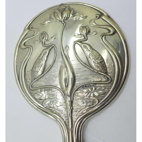 852 - An Art Nouveau silver backed hand mirror, Chester 1906